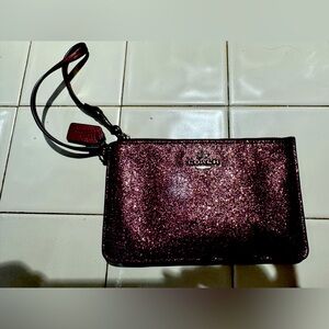 Burgundy glitter coach wristlet